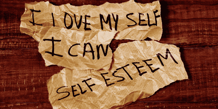 Torn paper showing self-love and self-esteem affirmations.