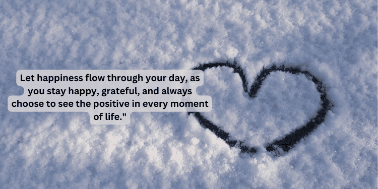 Heart drawn in snow with positive happiness quote
