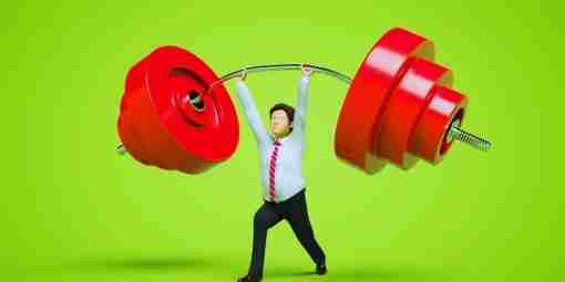 a person holding a heavy barbell in office attire representing hardwork